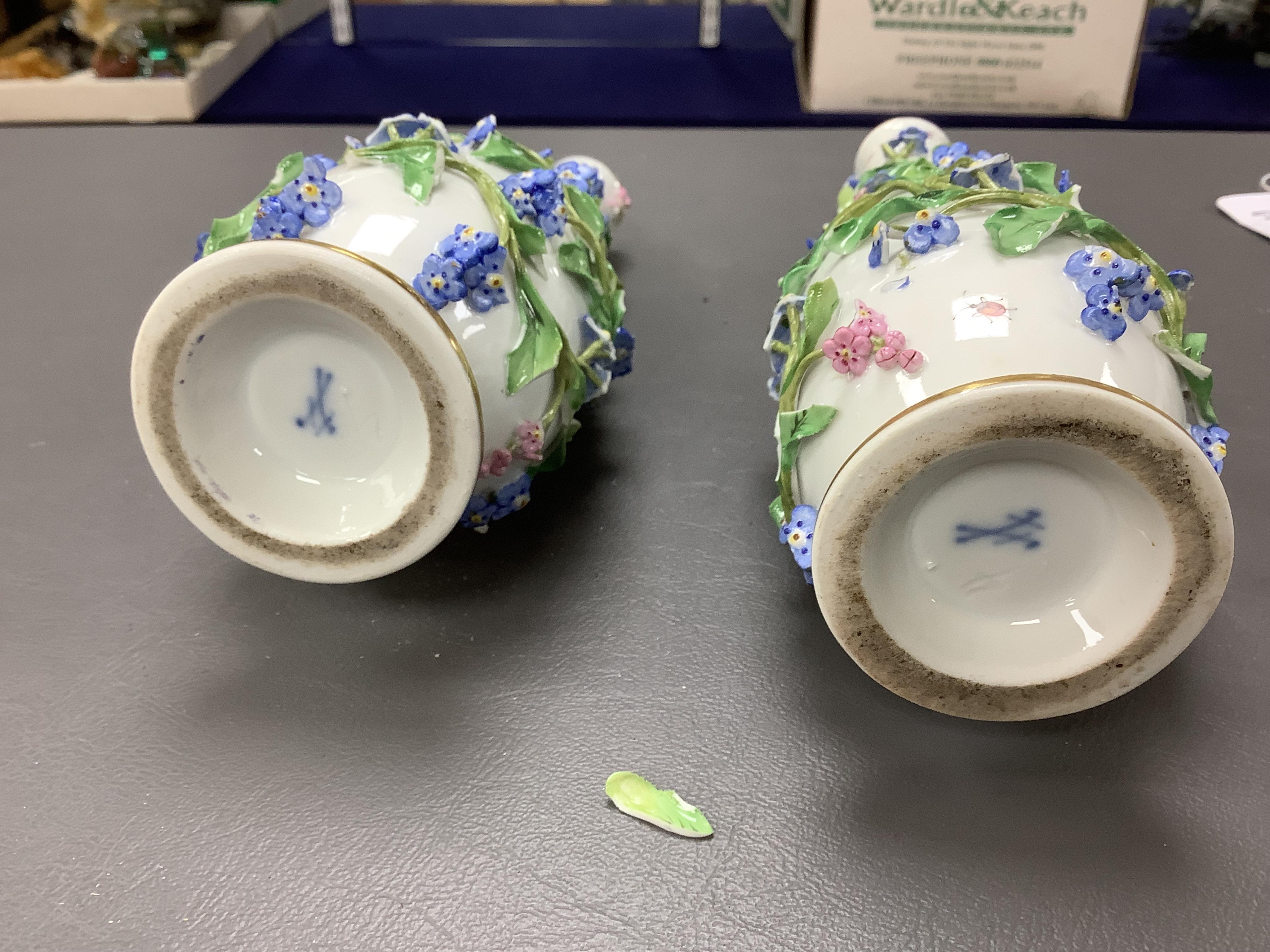 A pair of late 19th century Meissen flower encrusted vases and covers, 20cm high